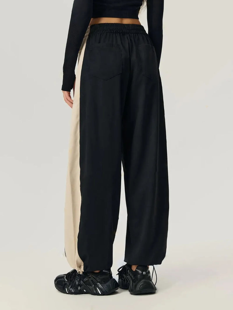 Black elastic waist pants with drawstring hem, view 2