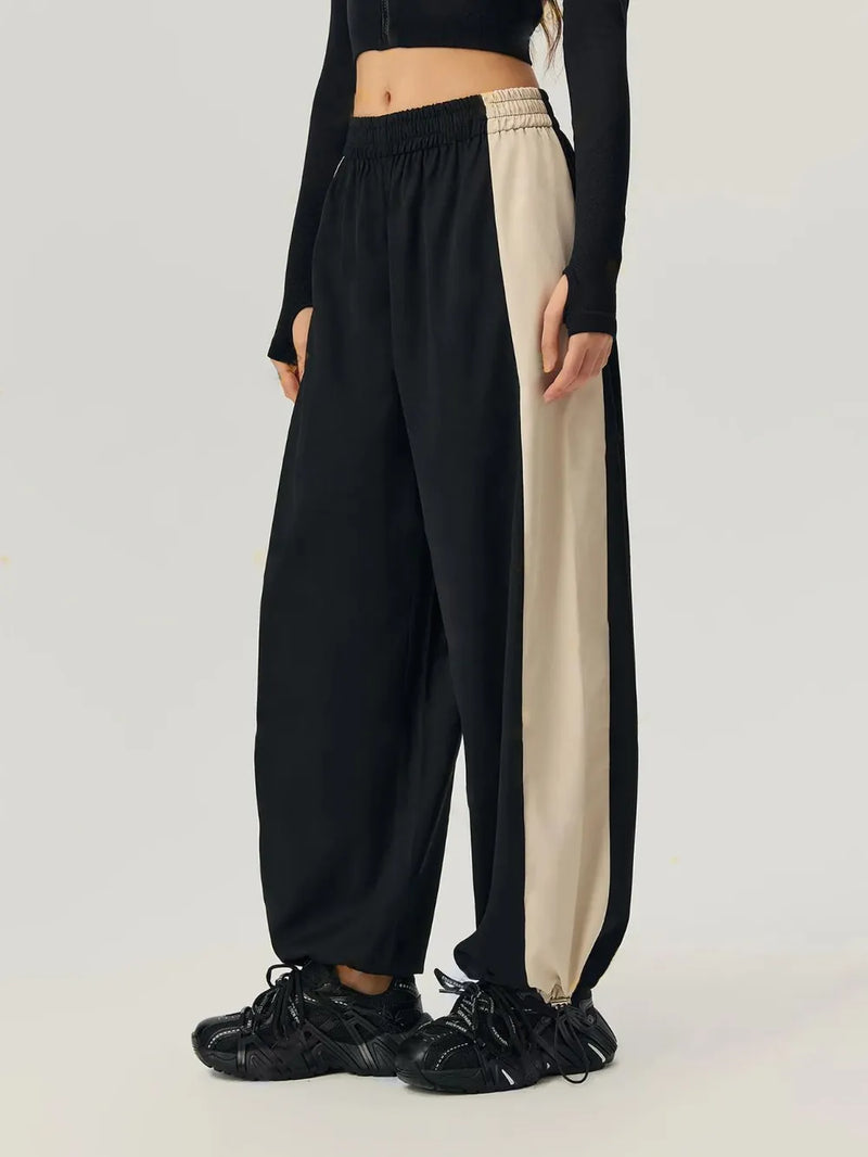 Black elastic waist pants with drawstring hem, view 4