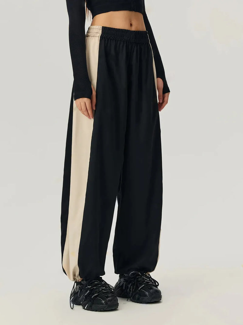 Black elastic waist pants with drawstring hem, view 3